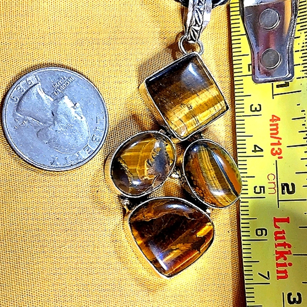 MULTI-STONES OF AN EXTRA LARGE, TIGERS EYE GEMSTONE PENDANT  18" STERLING CHAIN.